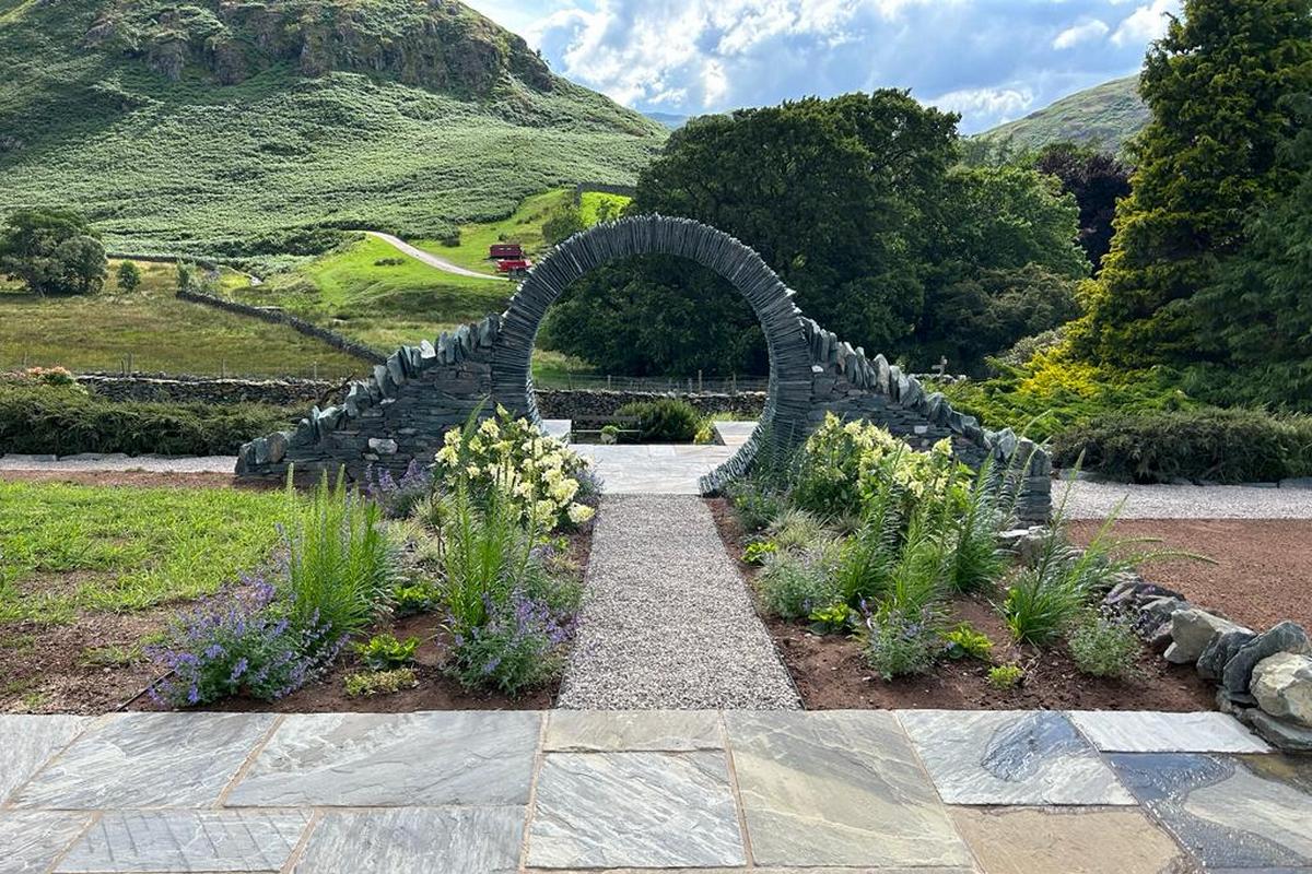 Garden design and Landscaping featiuring a slate moongate in the Lake District, CUmbria