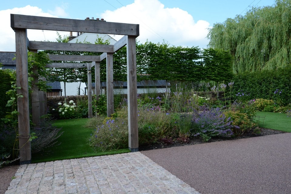 Larch pergola and pleached trees