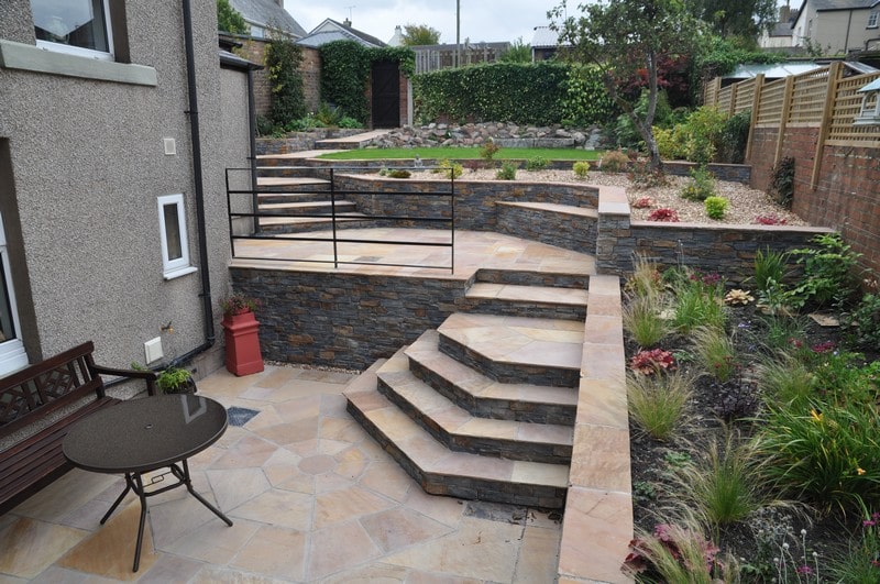 Steps and retaining walls in a steep garden in Cumbria